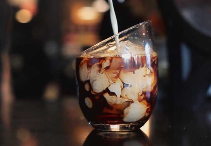 a cappucino being poured at Hampton Coffee Company